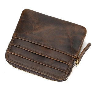 Macro shot of dark brown crazy horse leather card wallet with multi-card slots and zippers