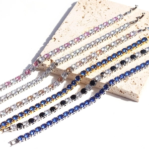 Detail of multi-color tennis bracelets with 5mm cubic zirconia on a textured stone base