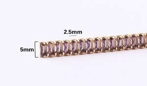 Detailed close-up of 2.5mm and 5mm purple zircon stones on a gold necklace chain