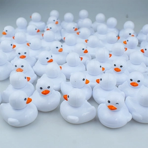 Realistic white duck figurine toys set with orange beaks and cute winking expression