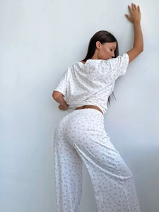Detail view of heart floral print pajama set with soft drape and loose casual fit