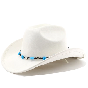 Detailed view of white felt cowboy hat with ethnic beads and black braided band