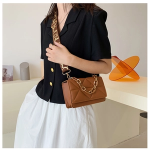 Brown leather crossbody bag with triangle quilting and stylish thick chain detail
