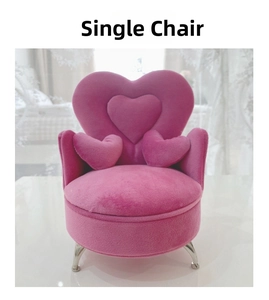 Pink heart-shaped jewelry box chair with soft velvet fabric and silver metallic legs