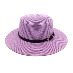 Detailed texture of lavender straw flat top hat with black belt and golden buckle