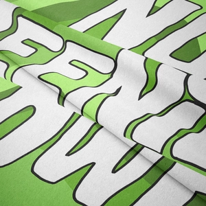 Detailed macro view of the soft woven fabric texture with bohemian patterns and green prints