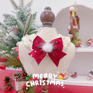 Christmas pet bow tie with gold star embroidery and velvet collar on holiday display