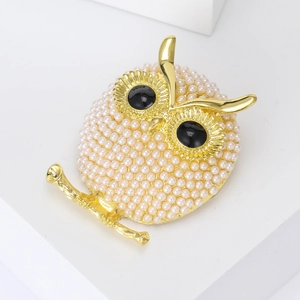 Charming owl brooch with white imitation pearls and black gem eyes on gold metal