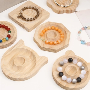 Natural pine wood display trays for bracelets and jewelry in various geometric shapes