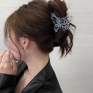 Blue butterfly hair claw clip with silver hollow metal and navy blue rhinestone gem