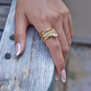 Set of three gold-plated stainless steel rings with white zircon and pear-shaped stone