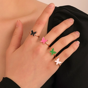 Rotating butterfly anxiety rings in rose gold finish with multicolor zircon stones