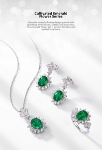 Close-up of S925 silver sunflower jewelry set with emerald and cubic zirconia stones
