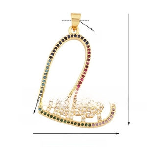 Detailed view of a gold-plated heart pendant featuring rainbow stones and HAPPY lettering