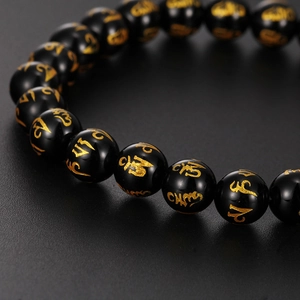 Bracelet ethnique en onyx noir avec perles Mantra dorées et tête de bouddha en acier