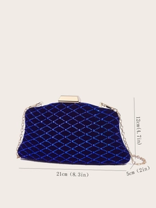 Macro detail of navy velvet evening clutch with blue rhinestones and gold chain