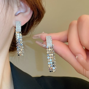 Silver drop earrings with sparkling rhinestones and layered metallic round sequins
