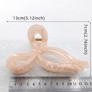 13cm light pink bow hollow hair claw clip with dimensions shown on white background
