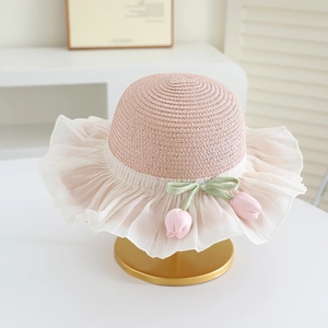 Detail of pink straw hat with white chiffon pleated brim and tulip floral ornaments