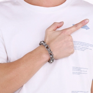 Close-up of vintage titanium steel bracelet with engraved geometric textures for men