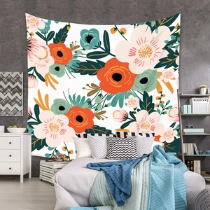 Detail of floral tapestry hanging on grey wall showing large orange and pink flowers