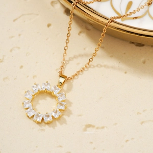 Vintage gold sunflower pendant necklace featuring radiant square-cut cubic zirconia stones