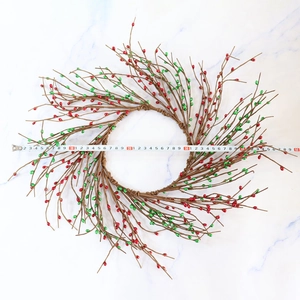 Red and green pip berry Christmas wreath 50cm diameter measured on white background