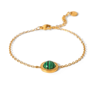 Detail of a gold stainless steel bracelet with a green striped malachite gemstone inlay