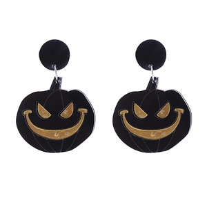 Close-up of Halloween pumpkin earrings with black and gold acrylic finish details