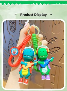 Close-up of cute cartoon dinosaur keychains with woven lanyards and adorable tags