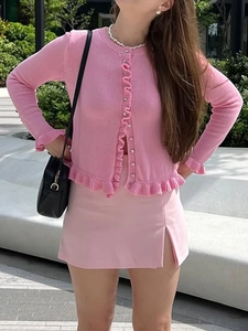 Chic pink knit long sleeve button-up cardigan and matching side slit mini skirt set