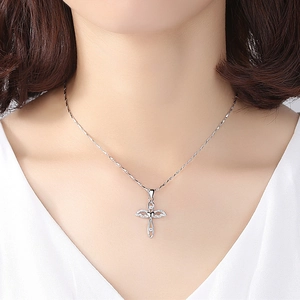 S999 sterling silver cross necklace with winged pendant and sparkling zircon stones