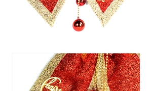Macro view of Christmas bow with red glitter fabric and golden Merry Christmas sign