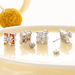 Titanium steel bow gift box stud earrings with orange and white square cubic zirconia