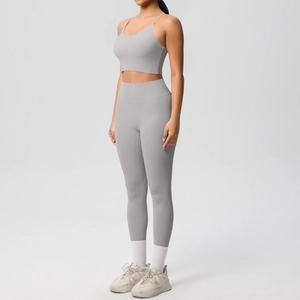 Grey yoga set with spaghetti strap crop top and high waist leggings on a model