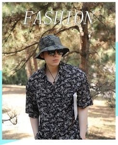 Outdoor camouflage bucket hat paired with black floral short sleeve shirt for men