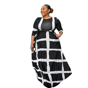 Plus size maxi dress featuring black and white grid geometric print and long sleeves