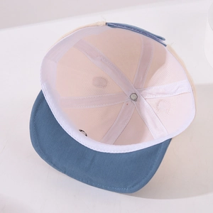 Detailed interior view of baby baseball cap showing breathable mesh lining and stitching