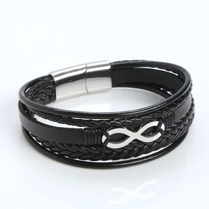 Macro shot of multi-layer black leather bracelet with infinity symbol and magnetic clasp