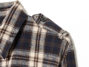 Detail of plaid midi dress collar and shoulder epaulette with black button detail
