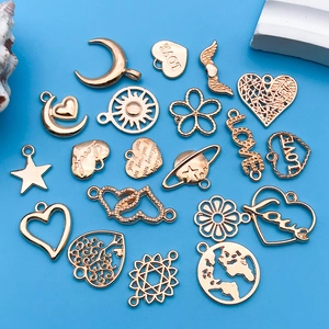 Variety of rose gold heart and star charms on a bright blue background for DIY jewelry