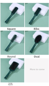 Detail view of five professional anti-static hair brushes in deep green with ergonomic handles