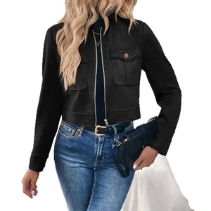 Detail of black suede short jacket featuring gold zippers and double chest flap pockets
