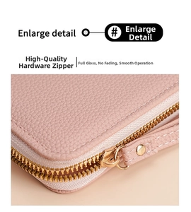 Close-up of pink litchi grain leather texture and durable gold hardware zipper detail