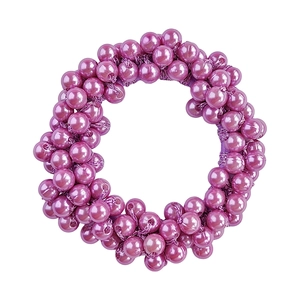 Close-up of pink pearls elastic hair tie for ponytails and buns on white background