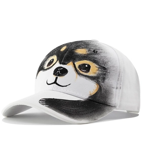 White cotton baseball cap featuring a large hand-painted dog animal pattern on front