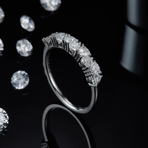 Macro shot of S925 sterling silver ring with sparkling round moissanite stones