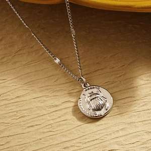 Vintage Egyptian scarab beetle pendant necklace in polished stainless steel for women