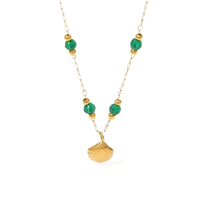 French style gold shell pendant necklace with green turquoise beads on white background