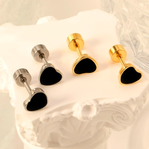 Elegant heart-shaped stud earrings in gold and silver finish with black enamel inlay